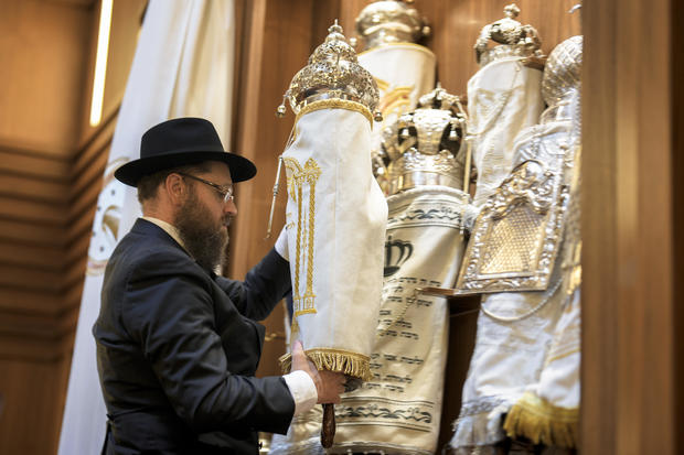 Rabbi Yehuda Teichtal prepares Torah scrolls at the synagogue of the Chabad community on October 13, 2023, in Berlin, Germany, prior to the first Shabbat service after the Hamas attacks on Israel. Photo by Markus Schreiber / AP 