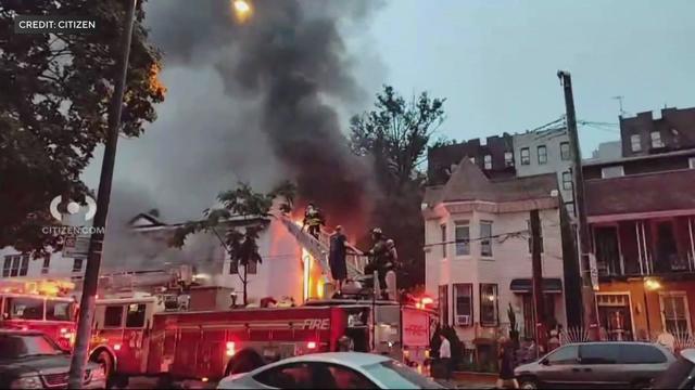 Firefighters battle a house fire. 