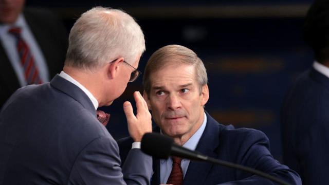 Rep. Jim Jordan talks to Speaker Pro Tempore Rep. Patrick McHenry as the House prepares to hold a vote on a new speaker of the House on Oct. 18, 2023. 