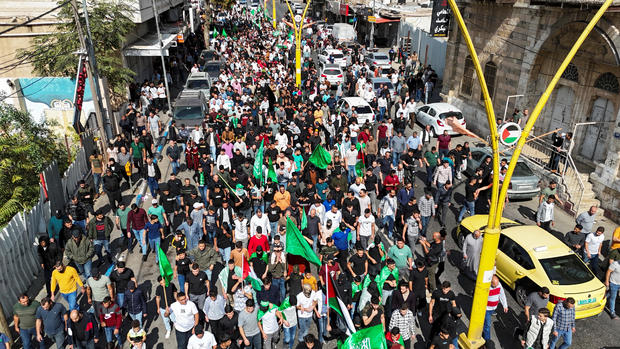 Hamas supporters demonstrate in the aftermath of a hospital blast in Gaza City, in Hebron 