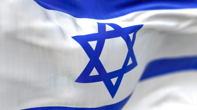 Close-up view of the Israel national flag waving in the wind 