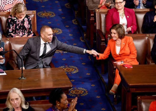 House Minority Leader Hakeem Jeffries holds hands with Rep. Nancy Pelosi as the House holds its second round of voting for a new speaker of the House at the U.S. Capitol on Oct. 18, 2023. 