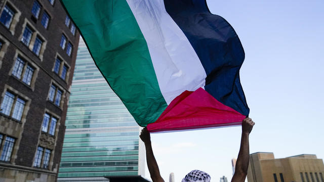 A protester waves a Palestinian flag during a demonstration near the United Nations headquarters Tuesday, May 18, 2021, in New York. 