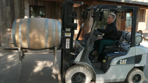 Pink operates forklift 