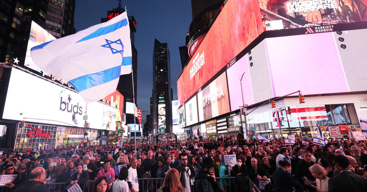 Local officials and loved ones rally in Times Square for release