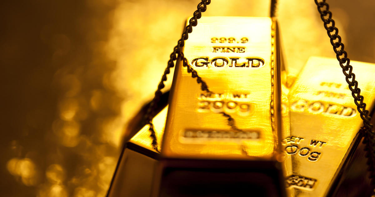 Gold tops record high of $2,100 per ounce. Here's why it's soaring.
