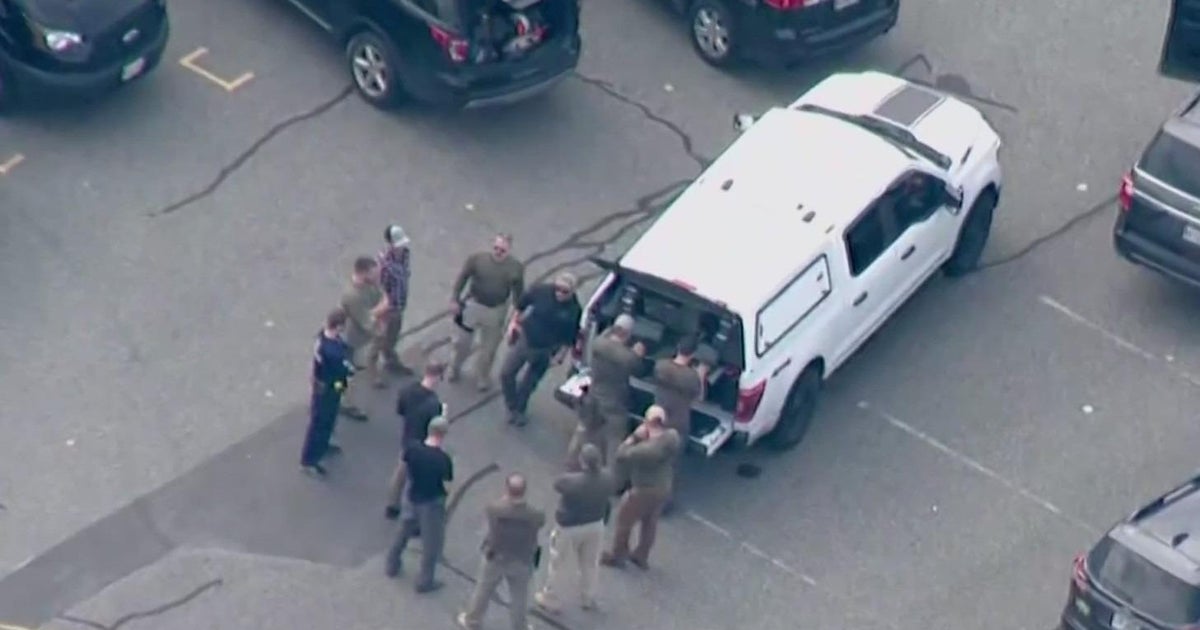 Police in Maine continue search for mass shooting suspect - CBS Chicago