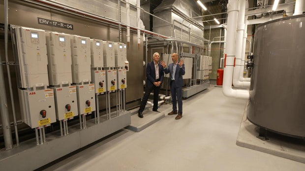 Dr. Lapook and Joe Allen in an Amazon mechanical room