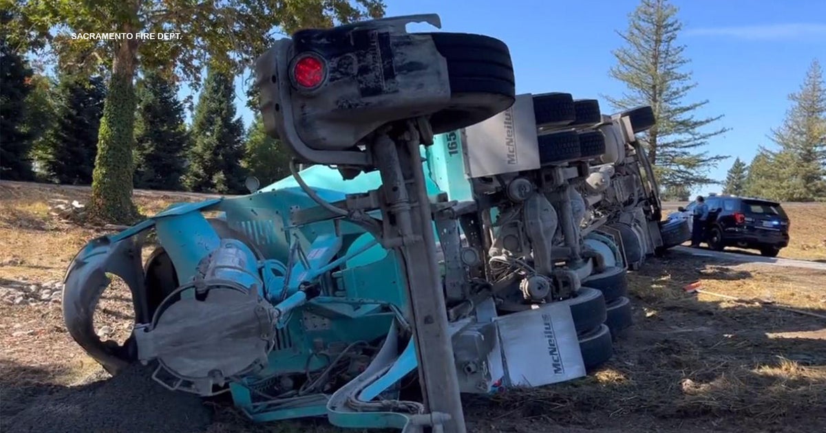 Cement truck rolls over on I-5 off-ramp in south Sacramento
