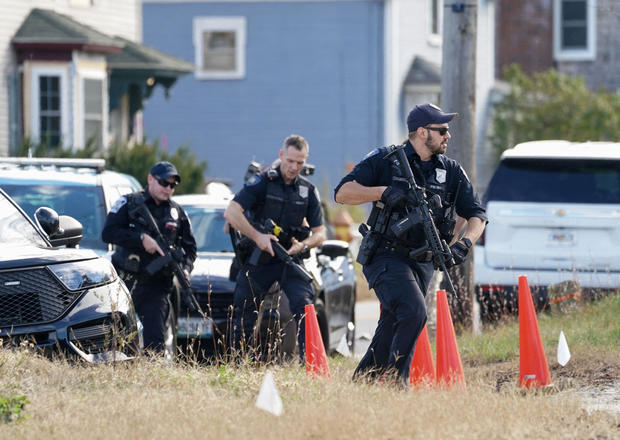 Members of law enforcement arrive at a farm in Lisbon Falls, Maine, as the search for the suspect in the deadly mass shooting in Lewiston continues, Oct. 27, 2023. 