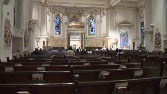 Parishioners sit in the pews inside Cathedral Basilica of St. James in Downtown Brooklyn. 