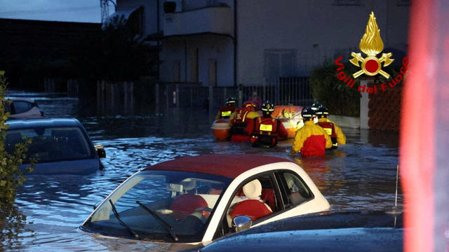 Italian firefighters work in flooded streets in Tuscany region 