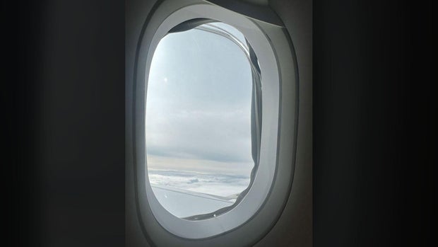 A windowpane is seen missing midflight from a window on an Airbus A321 plane heading from the U.K. to Orlando, Florida, Oct. 4, 2023.