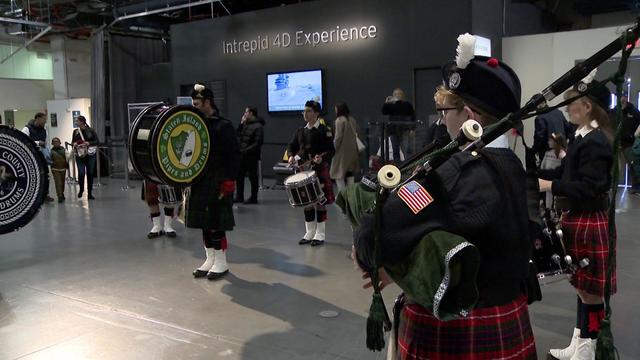 The Staten Island Pipes and Drums band performs aboard the USS Intrepid. 