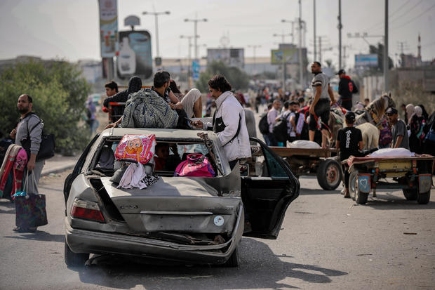 Palestinians leave their homes to escape Israel's air strikes Gaza 