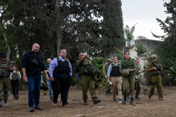 Chris Christie led by IDF Spokesperson Maj. Liad Diamond and Amir Ohana, Speaker of the Knesset, visits Kibbutz Kfar Aza on November 12, 2023, in Kfar Aza, Israel. 
