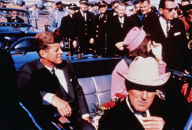 President John F. Kennedy and first lady Jacqueline Kennedy are seen in their motorcade in Dallas on Nov. 22, 1963