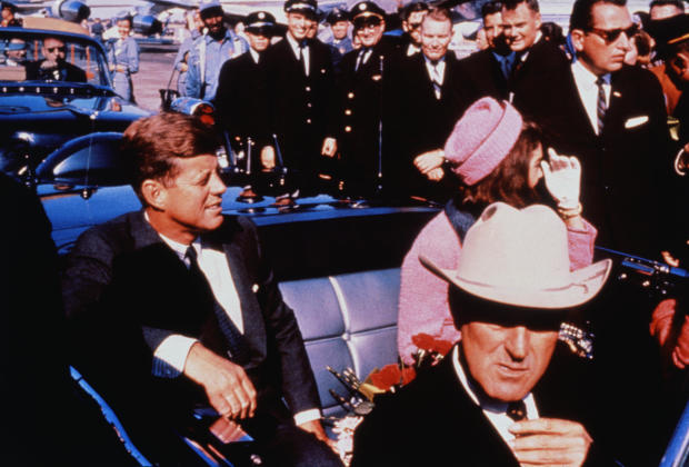 President John F. Kennedy and first lady Jacqueline Kennedy are seen in their motorcade in Dallas on Nov. 22, 1963 