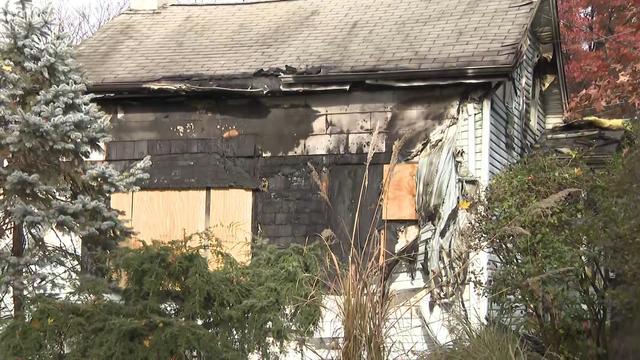 A home in Bogota with melted siding and other fire damage. 