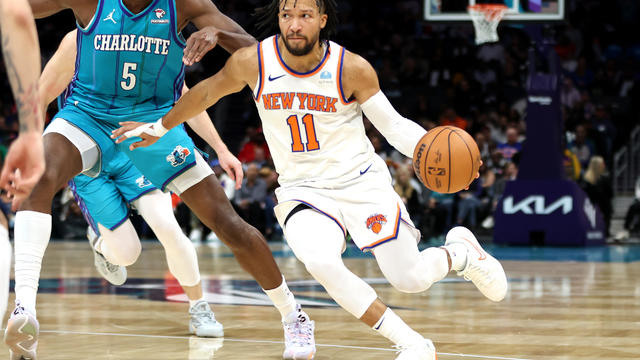 Jalen Brunson #11 of the New York Knicks drives to the basket during the first half of an NBA game against the Charlotte Hornets at Spectrum Center on November 18, 2023 in Charlotte, North Carolina. 