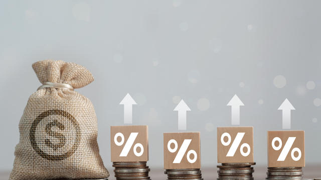 Concepts and financial investment business stock growth. Stack of silver coins with trading chart in financial. 