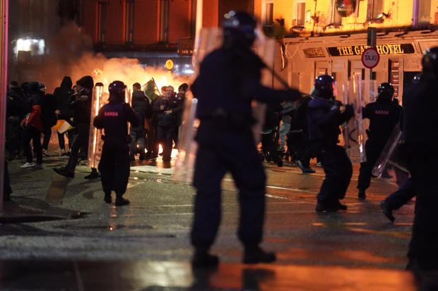 Police in Dublin clash with violent rioters in the city center 