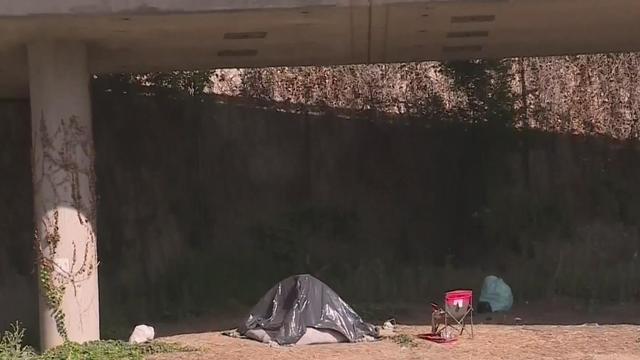 homeless-tent-side-of-highway.jpg 