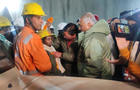 A worker is checked out after being rescued from a partially collapsed tunnel in Uttarkashi, India, Nov. 28, 2023. 
