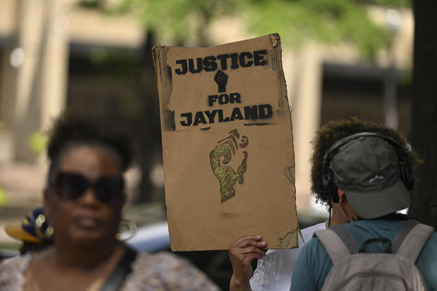People rally in front of the Department of Justice in Washington D.C., United States on June 27, 2023, to mark the first anniversary of the shooting Jayland Walker. 