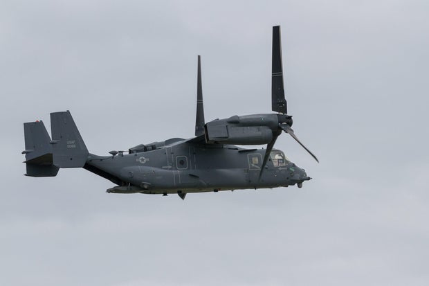 A USAF Bell Boeing V22 Osprey flying in front of the air-