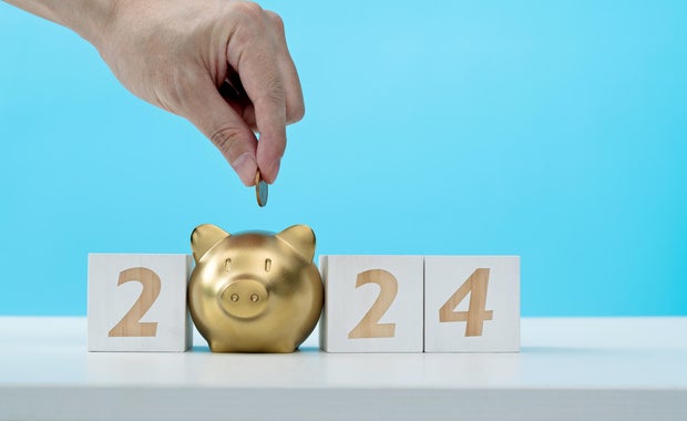 2024 new year and piggy bank on the table