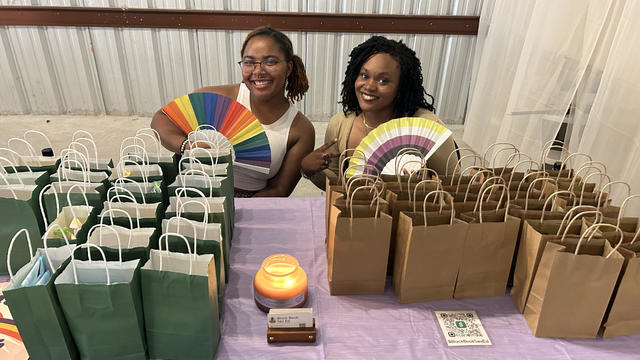 San Antonio college students Limya Harvey (left) and Cydney Mumford (right) distribute free kits 