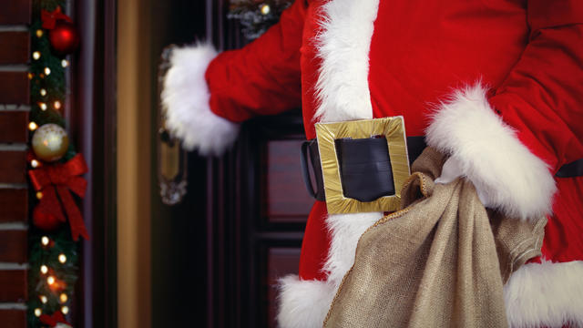 Merry Christmas and happy holidays! Santa Claus brings lots of presents 