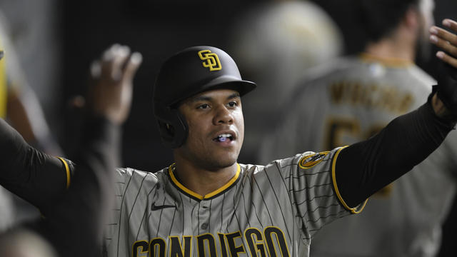 San Diego Padres' Juan Soto celebrates with teammates in the dugout after scoring on a Jurickson Profar single during the second inning of a baseball game against the Chicago White Sox, Saturday, Sept. 30, 2023, in Chicago. 