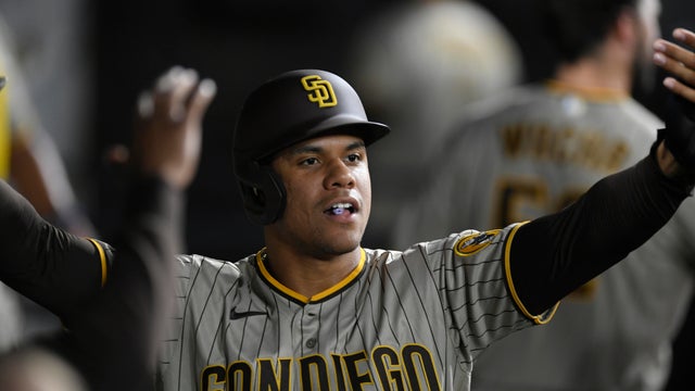 San Diego Padres' Juan Soto celebrates with teammates in the dugout after scoring on a Jurickson Profar single during the second inning of a baseball game against the Chicago White Sox, Saturday, Sept. 30, 2023, in Chicago.