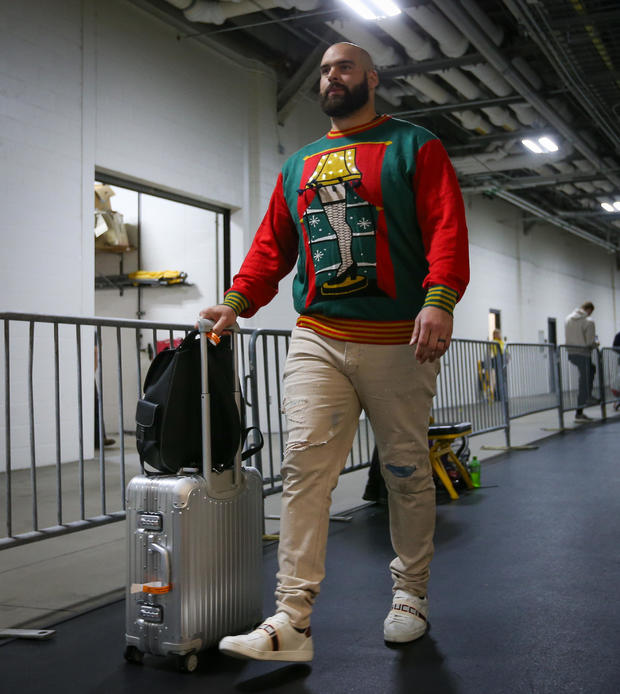 lawrence-guy-entering-stadium-wearing-a-christmas-story-sweater.jpg 