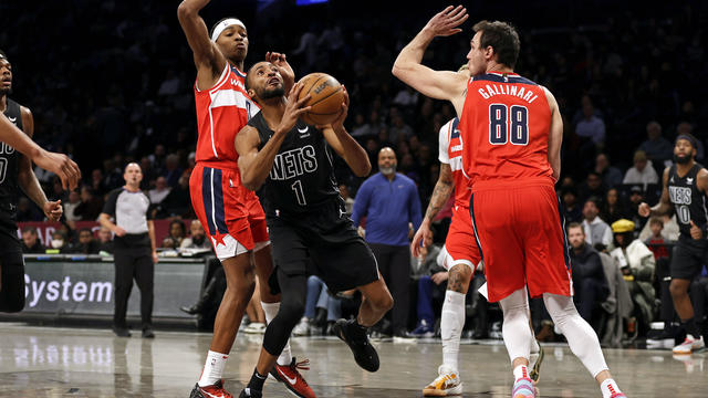 Brooklyn Nets forward Mikal Bridges (1) looks for a shot between Washington Wizards' Bilal Coulibaly and Danilo Gallinari (88) during the first half of an NBA basketball game Friday, Dec. 8, 2023, in New York. 