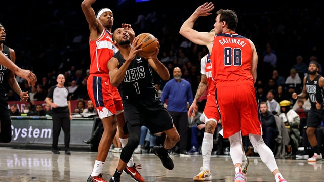 Brooklyn Nets forward Mikal Bridges (1) looks for a shot between Washington Wizards' Bilal Coulibaly and Danilo Gallinari (88) during the first half of an NBA basketball game Friday, Dec. 8, 2023, in New York.