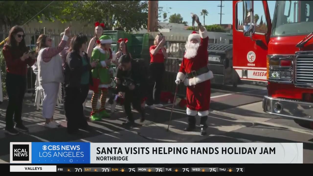 Santa Claus visits the Helping Hands Holiday Jam in Northridge