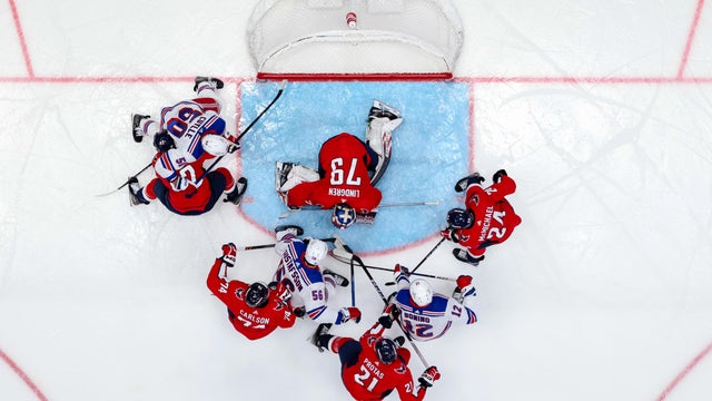 Charlie Lindgren #79 of the Washington Capitals makes a save as players fight for position during the second period of the game at Capital One Arena on December 9, 2023 in Washington, DC.