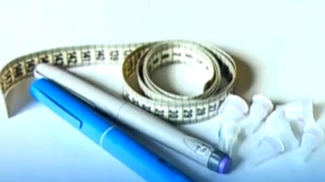 Injections for weight loss with Semaglutide. An obese woman gives a hormonal injection into the abdomen with a pen syringe. 