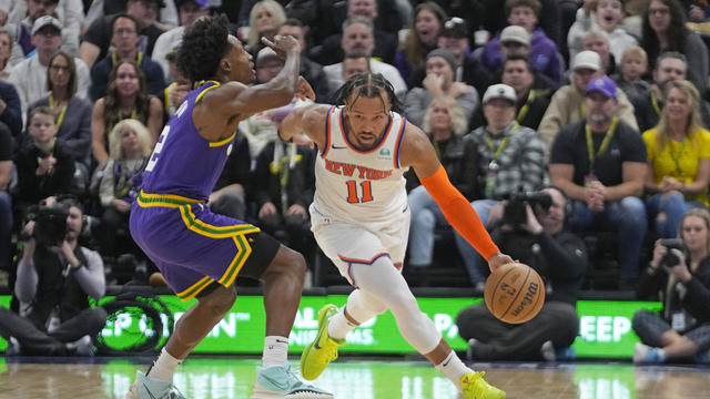 New York Knicks guard Jalen Brunson (11) drives as Utah Jazz guard Collin Sexton (2) defends during the first half of an NBA basketball game Wednesday, Dec. 13, 2023, in Salt Lake City. 
