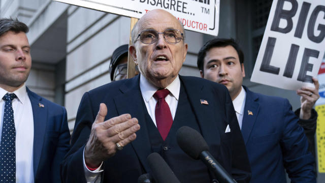 Rudy Giuliani speaks to reporters outside the federal courthouse in Washington, D.C., on Friday, Dec. 15, 2023. 