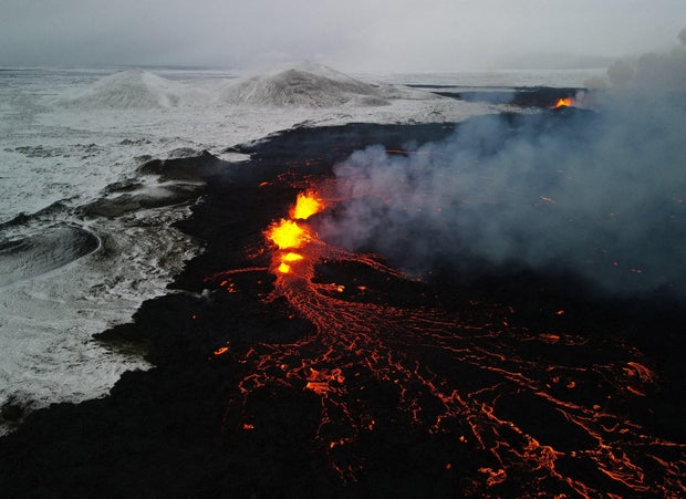 An aerial view of lava spewing from the site of the volcanic eruption north of Grindavik