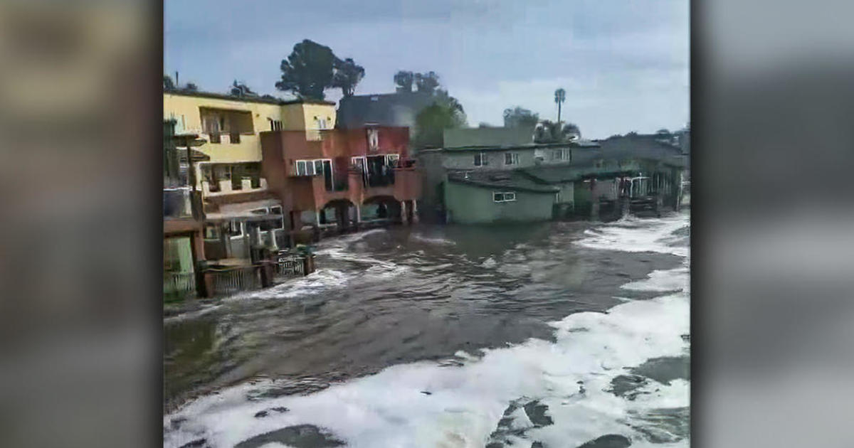 High surf floods waterfront residences in Capitola