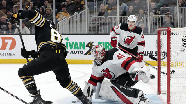 New Jersey Devils goalie Vitek Vanecek (41) stops Boston Bruins right wing David Pastrnak (88) during a game between the Boston Bruins and the New Jersey Devils on December 30, 2023, at TD Garden in Boston, Massachusetts. 