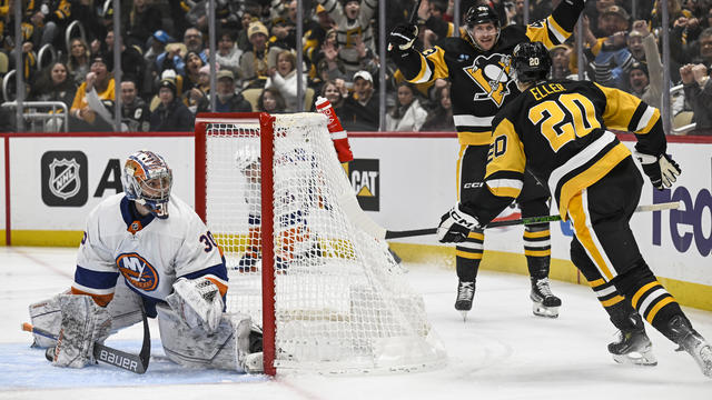 Pittsburgh Penguins center Lars Eller (20) celebrates his goal against New York Islanders goaltender Ilya Sorokin (30) with Pittsburgh Penguins center Jansen Harkins (43) during the first period in the NHL game between the Pittsburgh Penguins and the New 