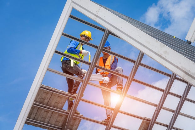 Roofer are installing asphalt shingles or roof.