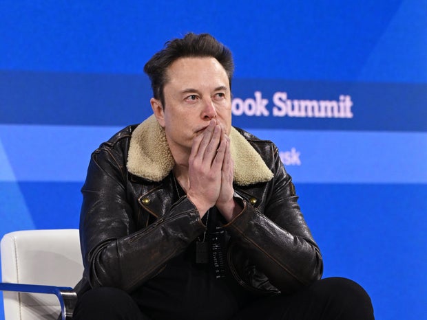 Elon Musk speaks onstage during The New York Times Dealbook Summit