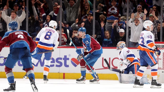 Cale Makar #8 and Valeri Nichushkin #13 of the Colorado Avalanche celebrate a game-winning goal by Nathan MacKinnon #29 in overtime against the New York Islanders at Ball Arena on January 2, 2024 in Denver, Colorado.